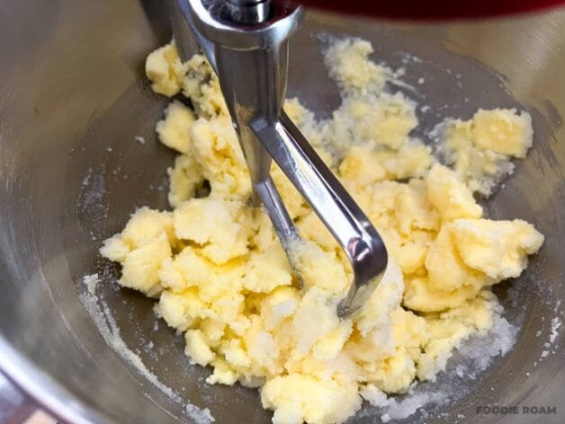 Butter and sugar partially creamed together in a stand mixer with a paddle attachment.