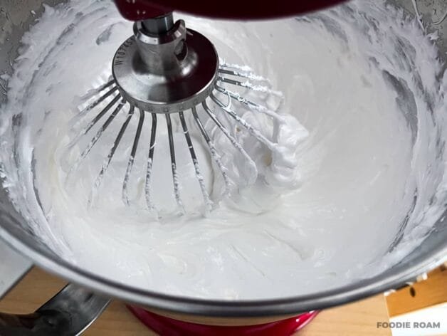 Stiff, glossy meringue whipped in a stand mixer with a whisk attachment.