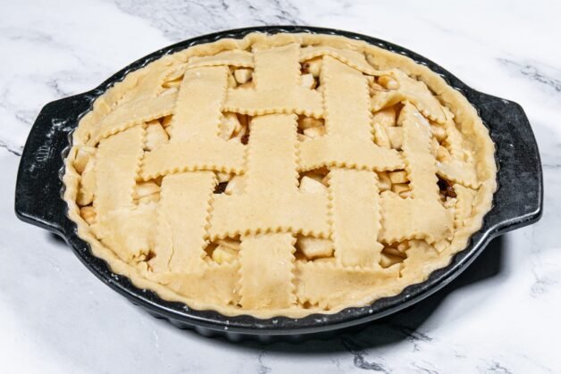 Assembled apple pie with a lattice top crust, before adding the egg wash.